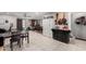 Open-concept living and dining area with tile floors, comfortable seating, and modern decor at 711 E Laurel Dr # 17, Casa Grande, AZ 85122