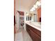 Bright bathroom features a double sink vanity and a separate toilet and shower area at 7712 S 37Th Way, Phoenix, AZ 85042