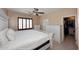A bedroom featuring a decorative dresser and access to the walk-in closet at 7712 S 37Th Way, Phoenix, AZ 85042