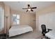 Cozy bedroom featuring a ceiling fan, natural light, and neutral color scheme at 7712 S 37Th Way, Phoenix, AZ 85042