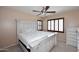 Bright bedroom features a large bed, dresser, and natural light at 7712 S 37Th Way, Phoenix, AZ 85042