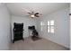 Versatile bonus room with a ceiling fan, natural light, and space for fitness or work at 7712 S 37Th Way, Phoenix, AZ 85042