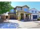 Beautiful two-story home featuring a stone-accented facade, desert landscaping, and a welcoming covered porch at 7712 S 37Th Way, Phoenix, AZ 85042