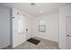 Bright foyer with tile floors, white walls, and a front door with window panels at 7712 S 37Th Way, Phoenix, AZ 85042