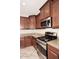 Well-equipped kitchen features stainless steel appliances, granite countertops and wooden cabinets at 7712 S 37Th Way, Phoenix, AZ 85042