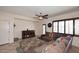 Inviting living room with tile floors, sectional sofa, and stylish storage cabinet at 7712 S 37Th Way, Phoenix, AZ 85042