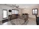 Spacious living area features a sectional sofa, ottoman, and tiled flooring at 7712 S 37Th Way, Phoenix, AZ 85042