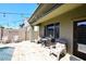 Relaxing outdoor patio area with comfortable seating and string lights for evening enjoyment at 7712 S 37Th Way, Phoenix, AZ 85042