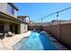 Private pool with water feature and string lights, surrounded by a brick patio at 7712 S 37Th Way, Phoenix, AZ 85042