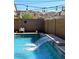 Backyard pool with waterfall feature and string lights at 7712 S 37Th Way, Phoenix, AZ 85042