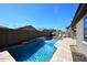 Private backyard with swimming pool, water feature, and string lights at 7712 S 37Th Way, Phoenix, AZ 85042