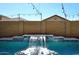 Close-up view of the private pool's water feature with stone details at 7712 S 37Th Way, Phoenix, AZ 85042