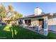 Enjoy outdoor living on the covered patio with views of the lush artificial grass and outdoor kitchen at 8618 E Via De Encanto --, Scottsdale, AZ 85258