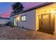 Cozy backyard entrance with a brick patio, comfortable seating, and a welcoming door at 8618 E Via De Encanto --, Scottsdale, AZ 85258