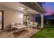 Enjoy outdoor relaxation on this covered patio with plush seating and soft lighting at 8618 E Via De Encanto --, Scottsdale, AZ 85258