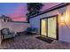 Outdoor brick patio with cozy furniture, a sliding glass door, and serene privacy at 8618 E Via De Encanto --, Scottsdale, AZ 85258
