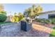 Outdoor living space features a built-in grill, mature trees, and a private patio; ideal for outdoor entertaining at 8618 E Via De Encanto --, Scottsdale, AZ 85258