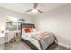 Carpeted bedroom with modern bed, side tables, and bright window at 8618 E Via De Encanto --, Scottsdale, AZ 85258