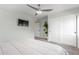 This carpeted bedroom has a ceiling fan and a closet with sliding doors at 8618 E Via De Encanto --, Scottsdale, AZ 85258