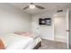This cozy bedroom includes a ceiling fan and a wall-mounted television at 8618 E Via De Encanto --, Scottsdale, AZ 85258