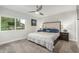 A carpeted bedroom features a modern bed, dual nightstands and a large window for plenty of sunlight at 8618 E Via De Encanto --, Scottsdale, AZ 85258