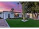 Contemporary home boasts a beautifully landscaped front yard with mature trees and cacti at 8618 E Via De Encanto --, Scottsdale, AZ 85258