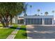 Contemporary exterior with modern garage doors, a manicured lawn, and desert landscaping at 8618 E Via De Encanto --, Scottsdale, AZ 85258