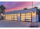 A home with modern garage doors featuring black trim and unique lighting at 8618 E Via De Encanto --, Scottsdale, AZ 85258