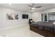 Large main bedroom features a ceiling fan, sliding glass door to backyard, and neutral decor at 8618 E Via De Encanto --, Scottsdale, AZ 85258