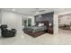 Spacious main bedroom features a wood accent wall, ceiling fan, sliding glass door, and modern decor at 8618 E Via De Encanto --, Scottsdale, AZ 85258