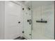 Shower featuring white marble tile surround, modern black fixtures, and a glass door at 8618 E Via De Encanto --, Scottsdale, AZ 85258