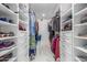 Walk-in closet with custom shelving, storage and marble flooring at 8618 E Via De Encanto --, Scottsdale, AZ 85258