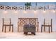 Cozy backyard featuring a charming fire pit, string lights, and comfortable seating at 8725 E Vista Dr, Scottsdale, AZ 85250