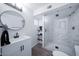 Bright bathroom with a glass-enclosed shower, modern vanity, and updated fixtures at 8725 E Vista Dr, Scottsdale, AZ 85250