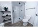 Clean and modern bathroom featuring a stylish glass shower and decorative shelving at 8725 E Vista Dr, Scottsdale, AZ 85250