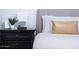 Close-up of a bedroom featuring a cozy bed, contemporary lamp, and nightstand at 8725 E Vista Dr, Scottsdale, AZ 85250