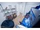 View of a playful bedroom with a bunk bed and shelving for storage and display at 8725 E Vista Dr, Scottsdale, AZ 85250