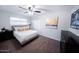 Relaxing bedroom featuring a comfortable bed, modern decor, and a flatscreen TV at 8725 E Vista Dr, Scottsdale, AZ 85250
