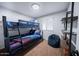 Cozy bedroom featuring a bunk bed with colorful bedding and a comfortable beanbag chair at 8725 E Vista Dr, Scottsdale, AZ 85250