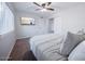 Cozy bedroom with a ceiling fan, closet and window providing ample natural light at 8725 E Vista Dr, Scottsdale, AZ 85250