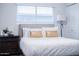 Comfortable bedroom featuring a bed, and a contemporary lamp. and nightstand at 8725 E Vista Dr, Scottsdale, AZ 85250