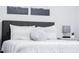 Bedroom featuring a double bed with plush pillows and modern decor. Neutral color scheme at 8725 E Vista Dr, Scottsdale, AZ 85250