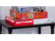 Close-up on a variety of board games including Gathering Feud, Pokemon Battle Academy, and Battleship at 8725 E Vista Dr, Scottsdale, AZ 85250