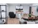 Cozy living room with comfortable seating, a large TV, and an open layout to the kitchen at 8725 E Vista Dr, Scottsdale, AZ 85250