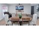 Open-concept living room features modern furnishings, a large television, and sliding doors to the outdoor patio at 8725 E Vista Dr, Scottsdale, AZ 85250