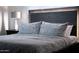 Close-up view of a luxuriously appointed main bedroom with stylish headboard and soft pillows at 8725 E Vista Dr, Scottsdale, AZ 85250