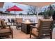 Inviting outdoor patio with comfortable seating, a fire pit, and ample space for relaxation at 8725 E Vista Dr, Scottsdale, AZ 85250