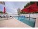 Sparkling pool with a decorative water feature and lounge chairs for enjoying sunny days at 8725 E Vista Dr, Scottsdale, AZ 85250