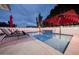 Stunning pool at night with a beautiful water feature and ambient lighting for evening swims at 8725 E Vista Dr, Scottsdale, AZ 85250