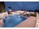 Backyard pool with waterfall feature, lounge chairs, and a patio for outdoor living and entertaining at 8725 E Vista Dr, Scottsdale, AZ 85250